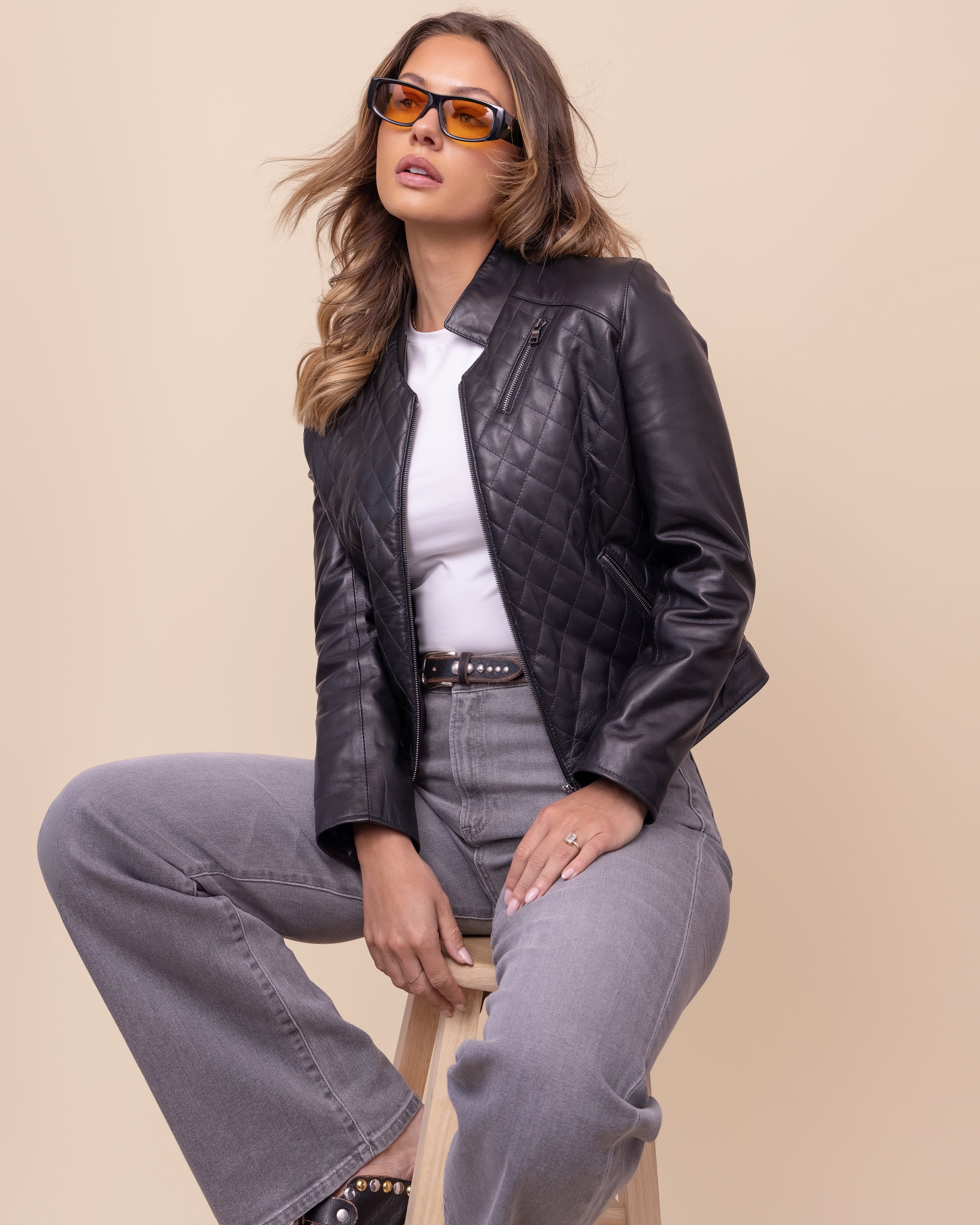 HYDE Carbon Noir quilted lambskin jacket — styled look with zip pocket detail and deep Carbon Noir finish