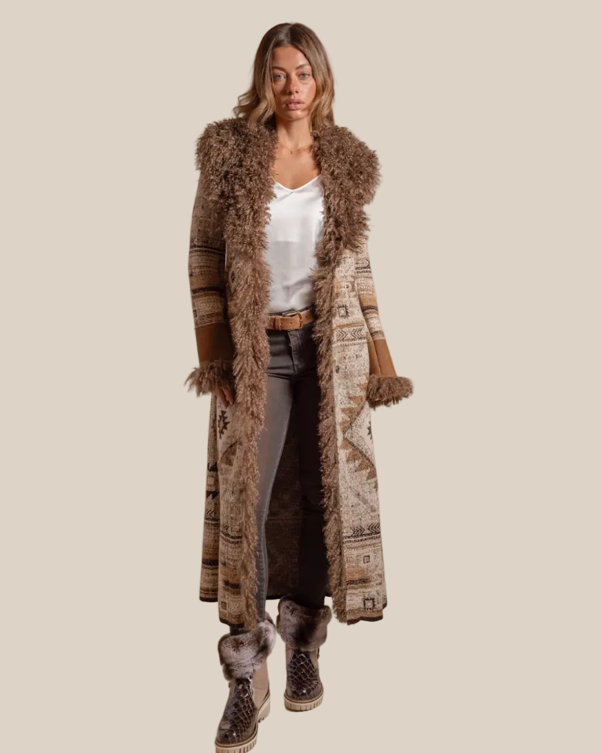 Woman wearing a long, patterned coat with fur trim on a beige background