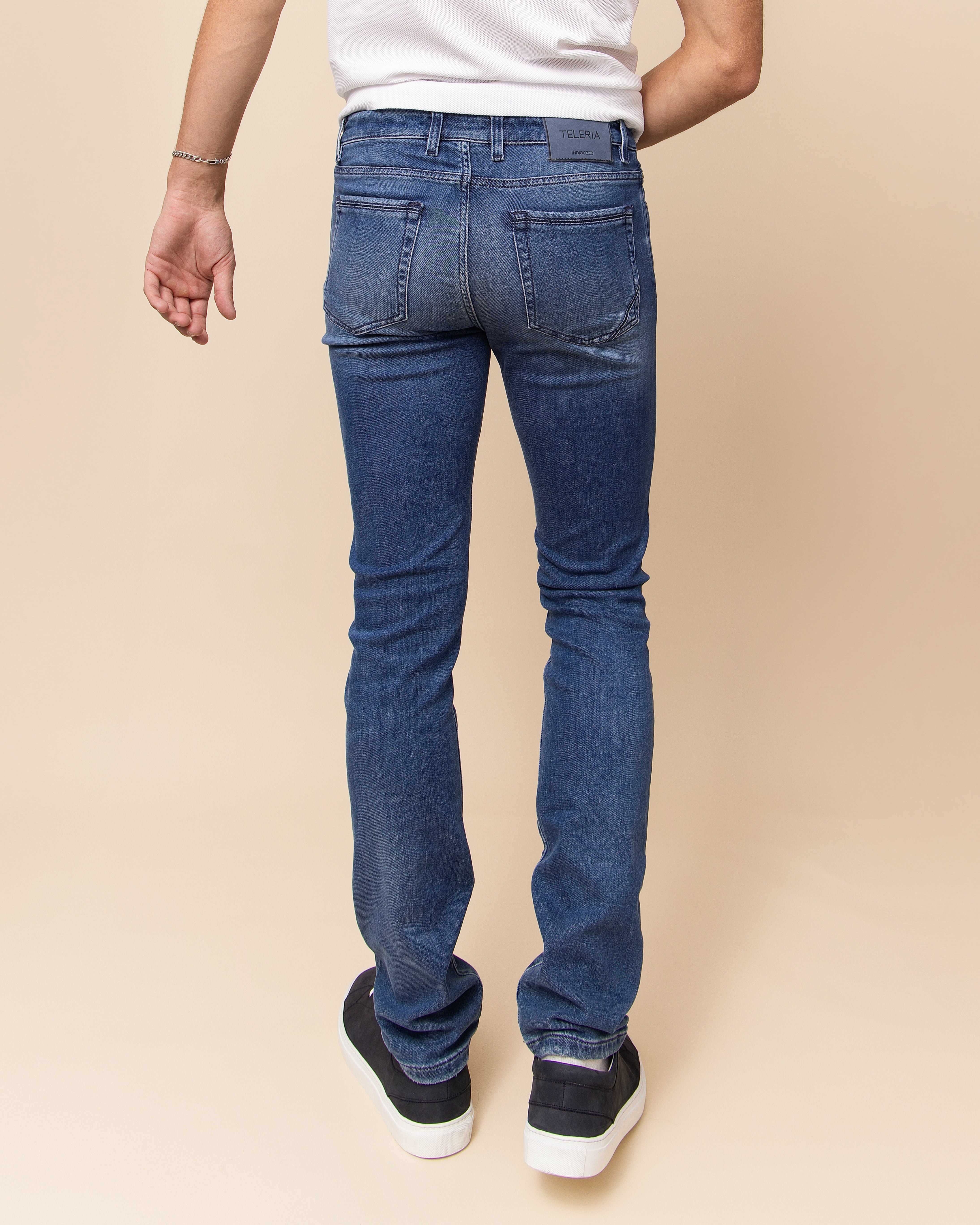 Teleria Zed medium blue denim for men, zip fly with button closure and coin pocket detail