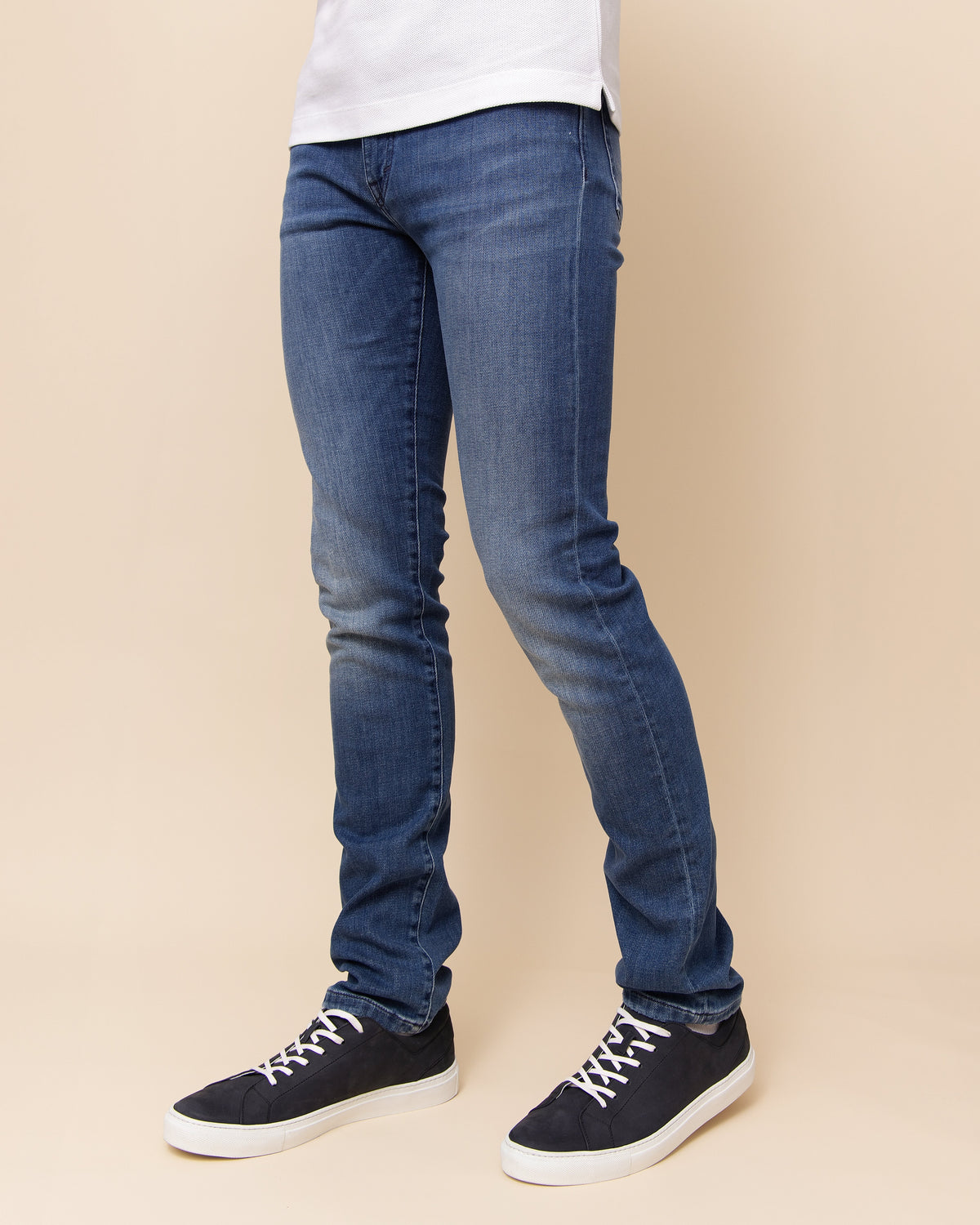 HYDE Cobra medium blue Italian denim styled with Vulcano navy nabuk sneakers, men's lower body detail
