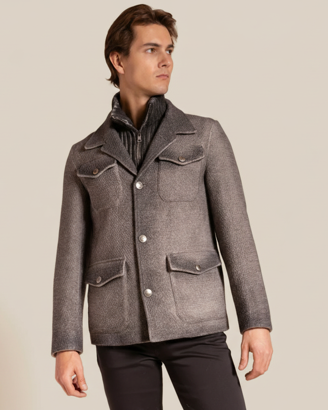 Man wearing a gray textured jacket on a beige background