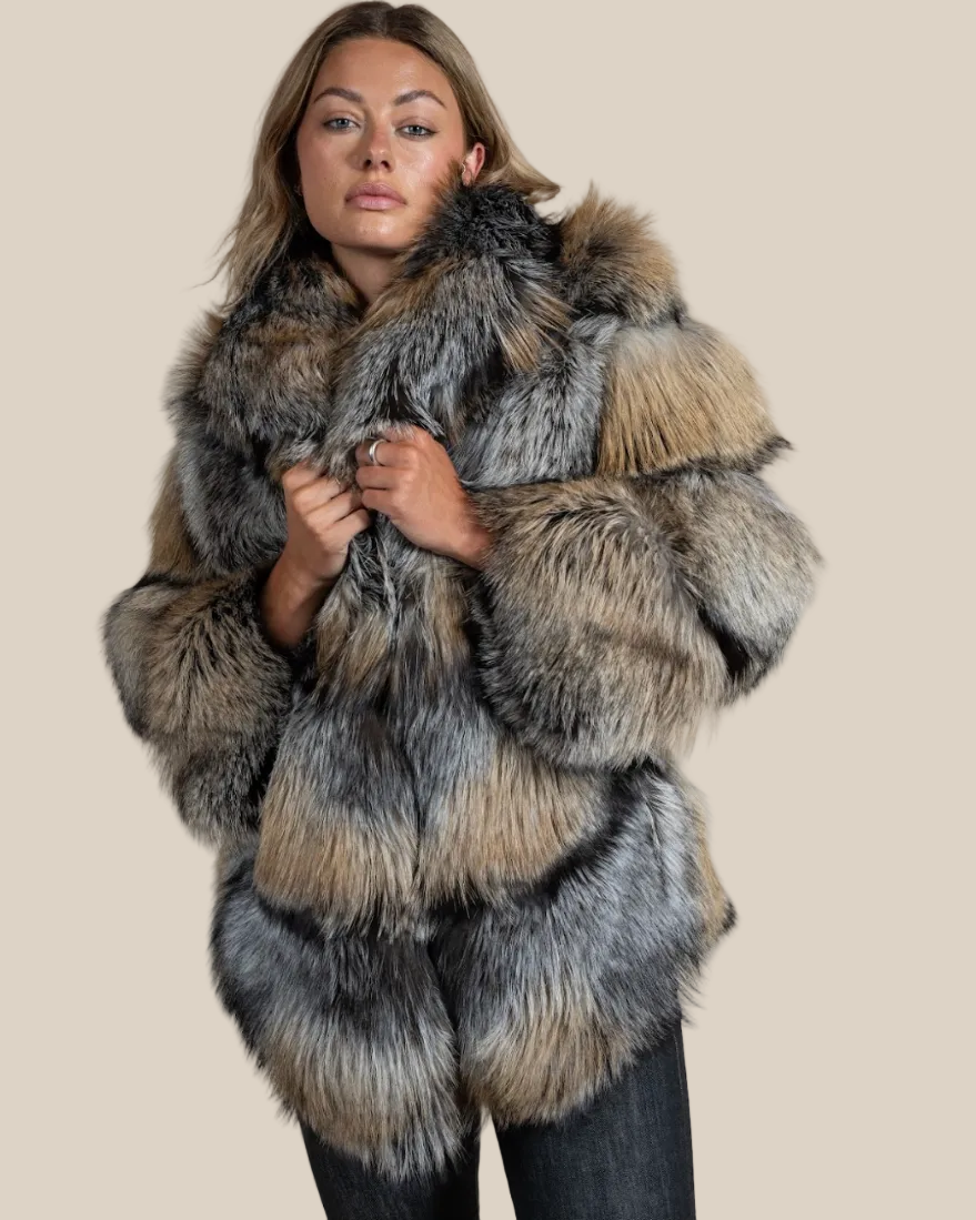 Person wearing a fur coat with a neutral background