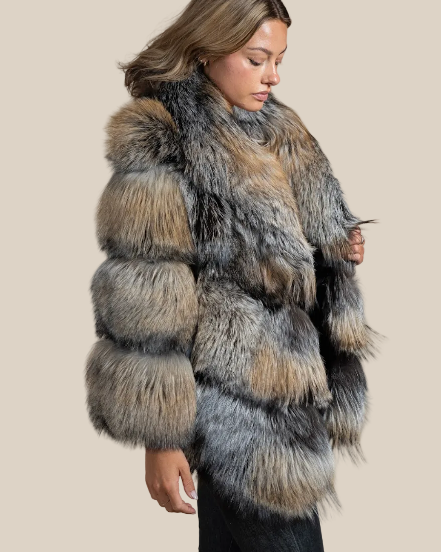 Woman wearing a fur coat with a neutral background