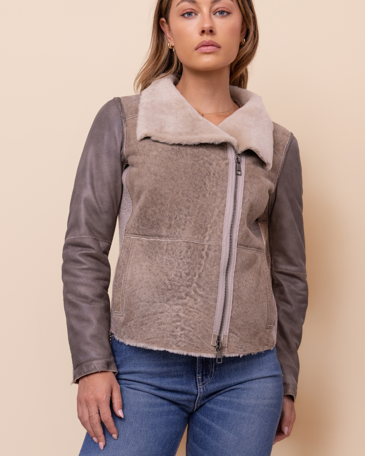 front view — asymmetrical zip and extended collar