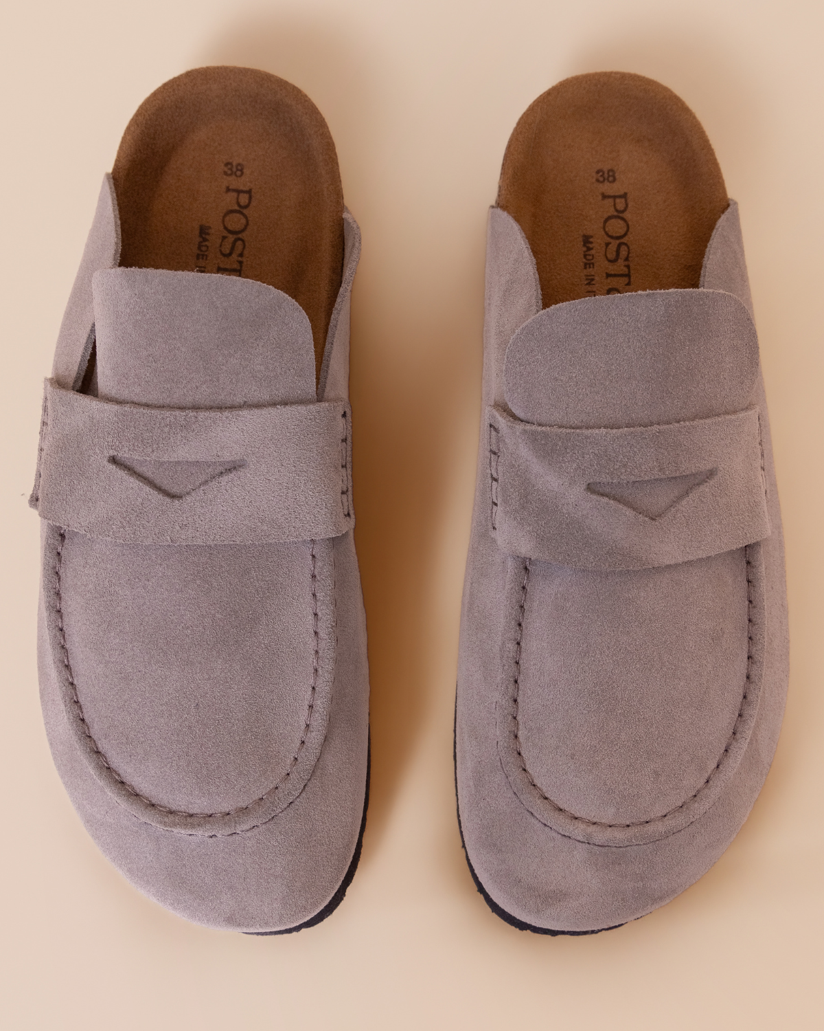 close-up — penny strap detail and dimensional suede texture