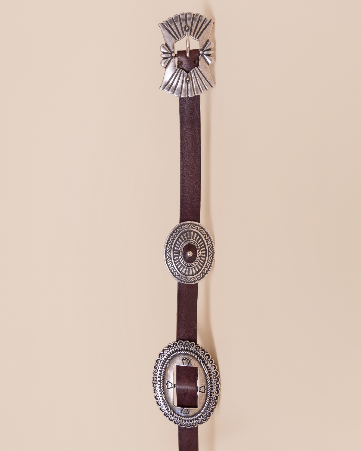 close-up — concho medallion detail and antiqued metal finish