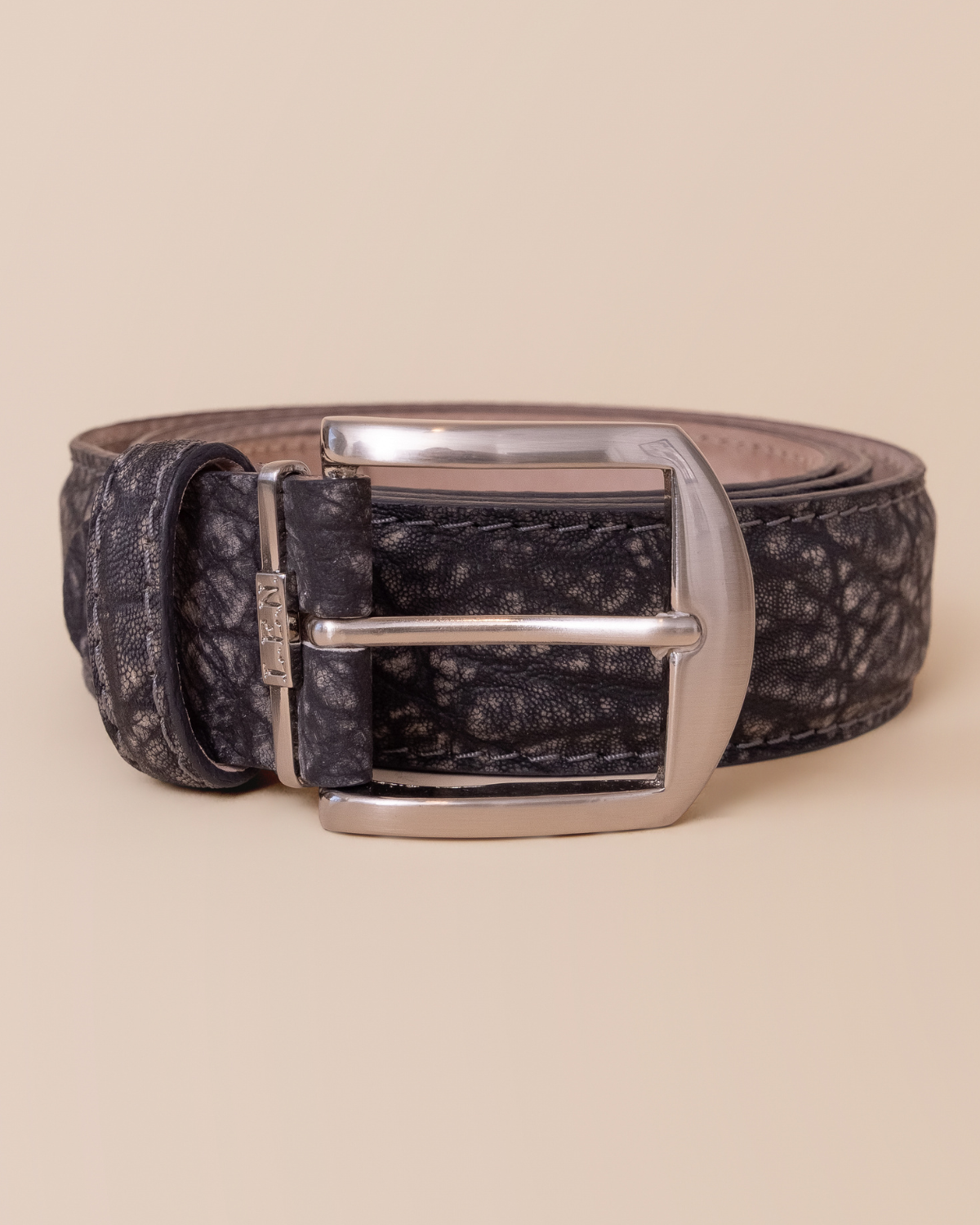 full view — natural pebbled grain and matte obsidian black sueded finish
