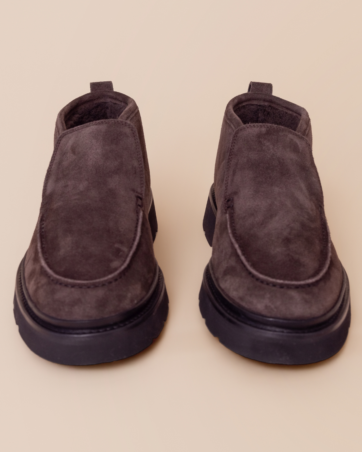 slip-on silhouette, pull-tab heel, and lug sole