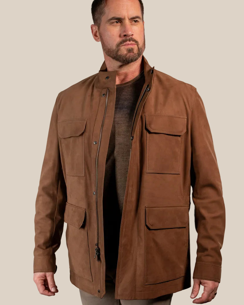 Man wearing a brown jacket on a beige background