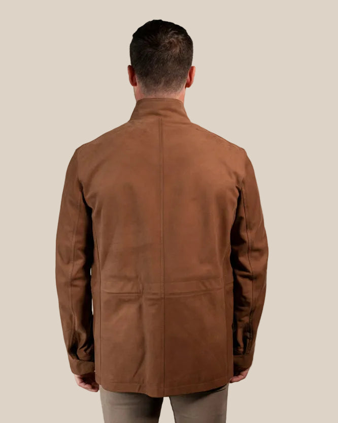 Man wearing a brown jacket on a beige background