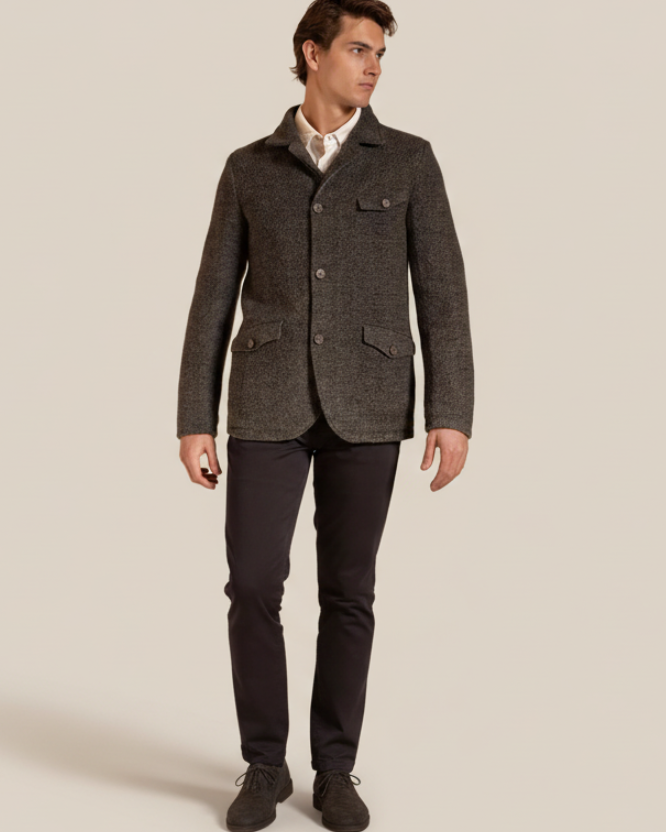 Man wearing a green textured jacket on a beige background