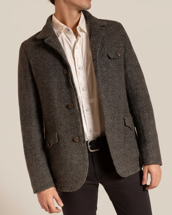 Gray textured blazer over a white shirt on a neutral background