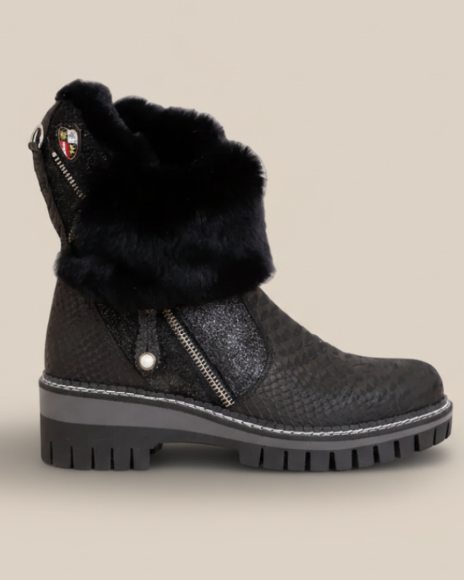 Black boot with fur lining on a white background
