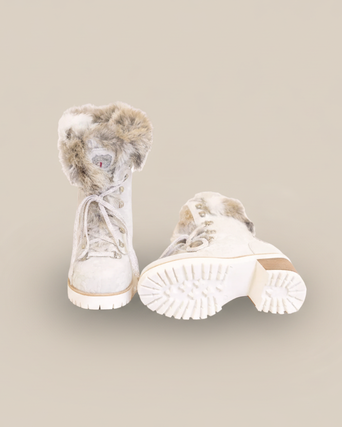 White winter boots with fur trim on a white background