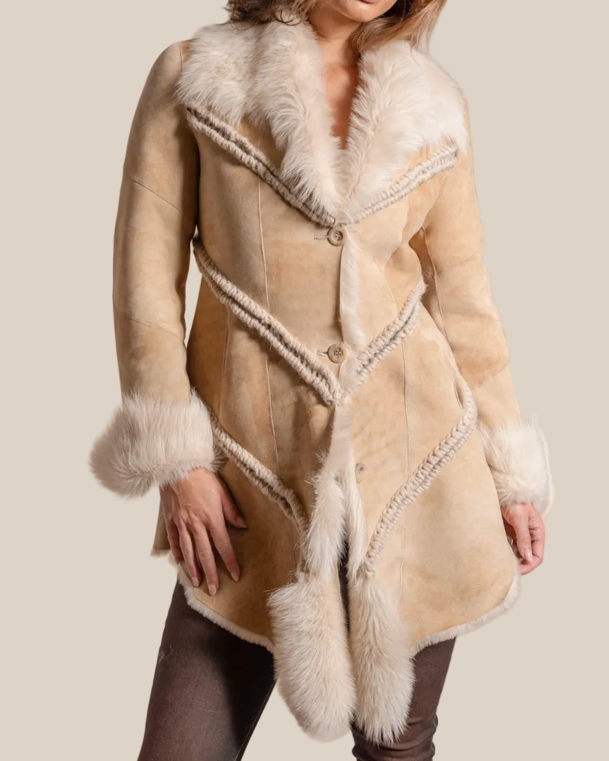 Beige shearling coat with white fur trim on a beige background