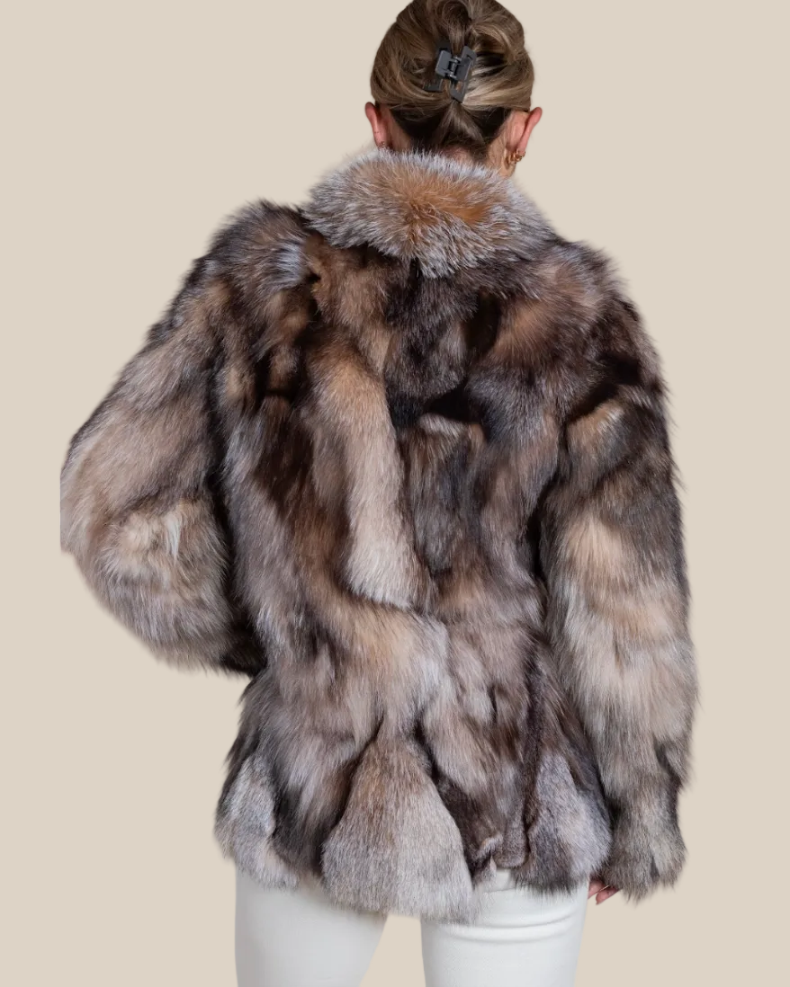 Person wearing a fur coat with a neutral background