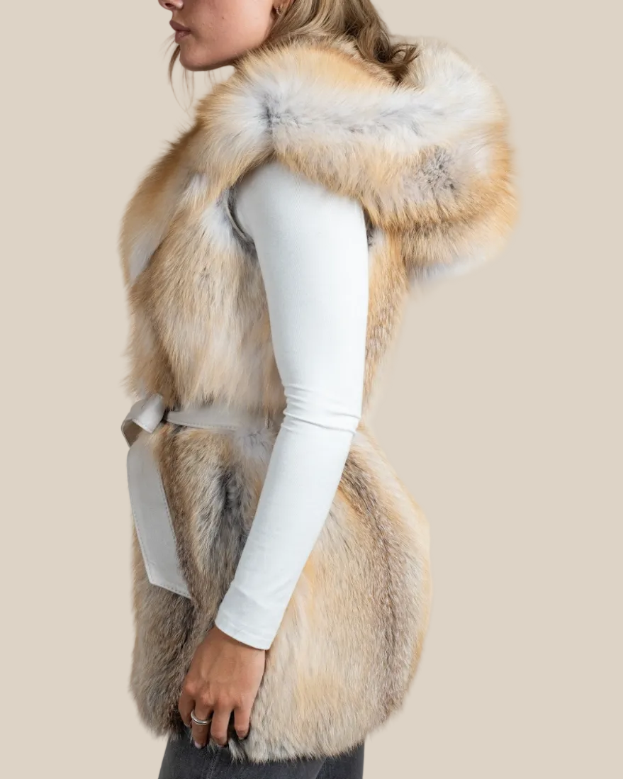 Person wearing a fur vest with a neutral background
