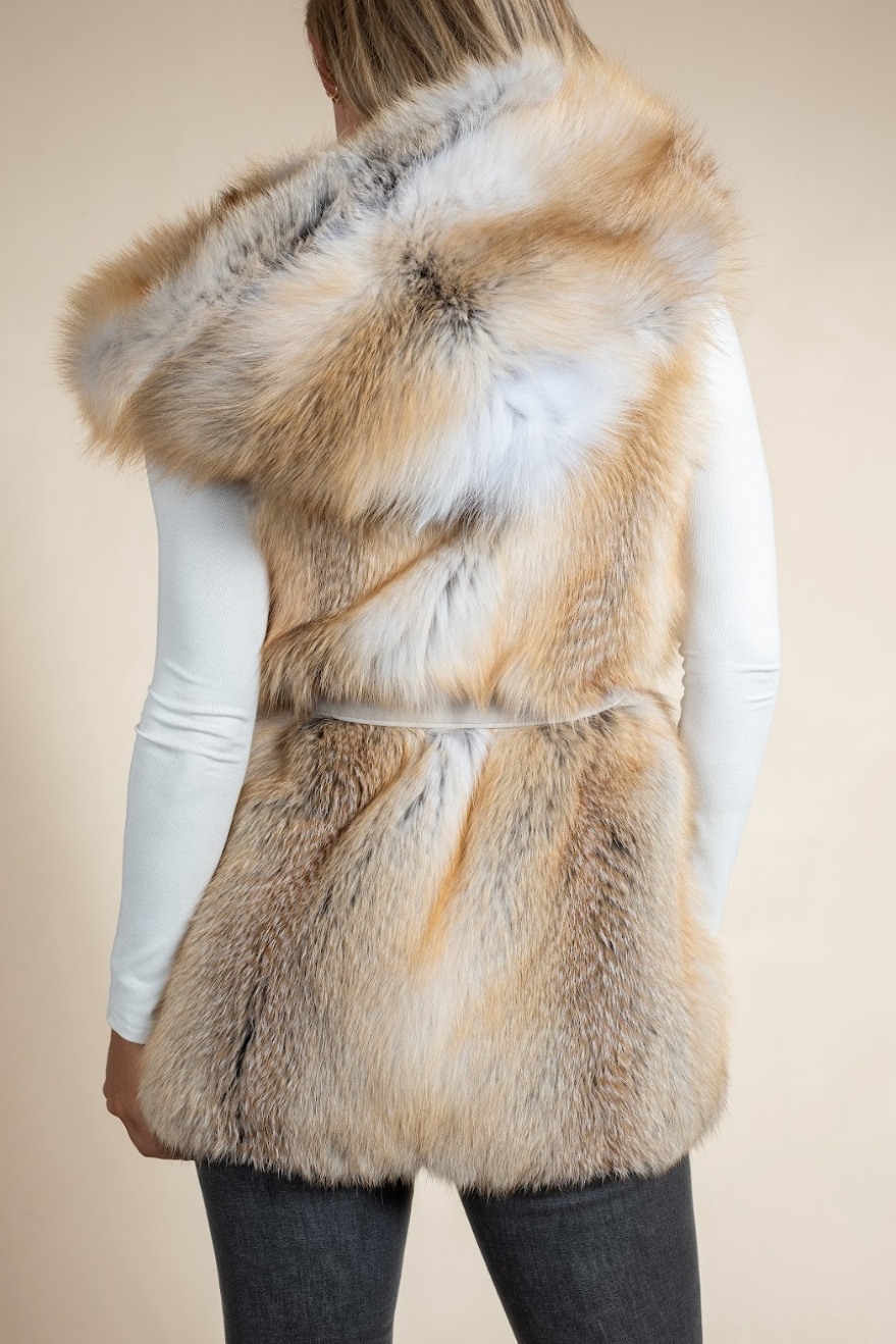 Fur vest worn by a person on a beige background
