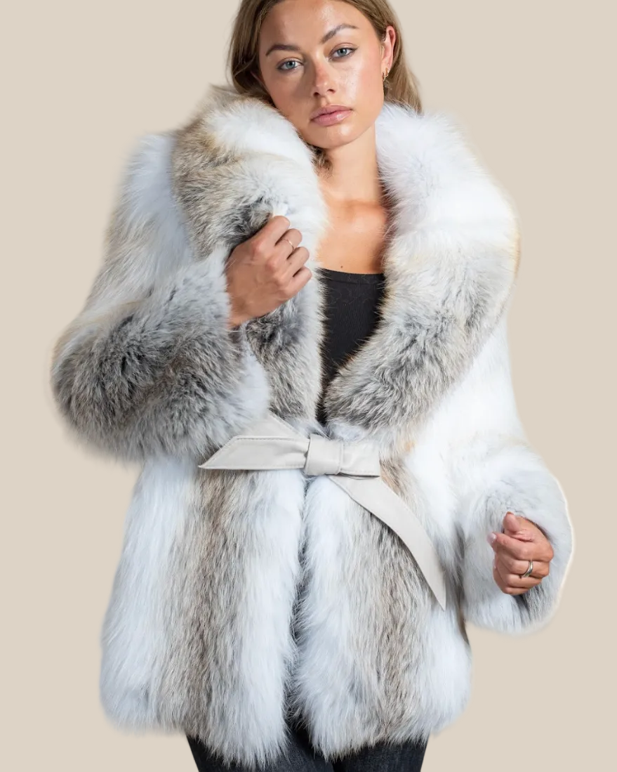 Woman wearing a fur coat with a neutral background