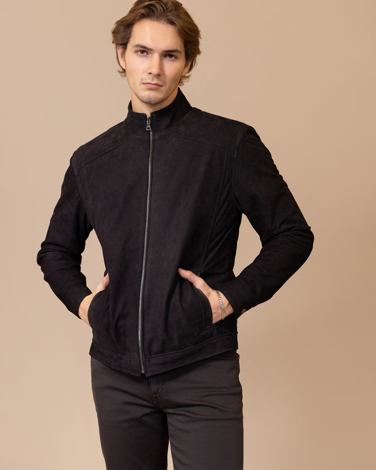 Model wearing the Savio Ace Rustic nubuck calfskin leather jacket, front view, showing the tailored silhouette and tonal leather finish.