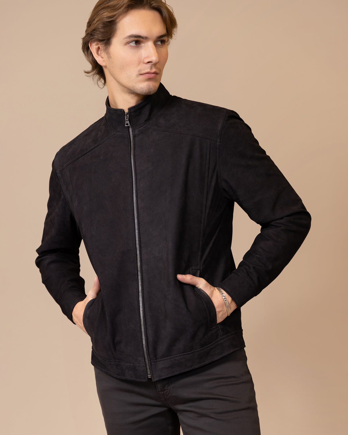 Model wearing the Savio Ace Rustic nubuck calfskin leather jacket, front view, showing the tailored silhouette and tonal leather finish.