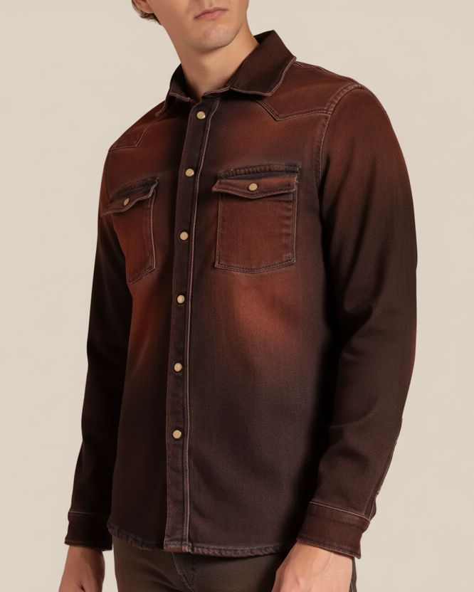 Man wearing a rust denim shirt on a beige background