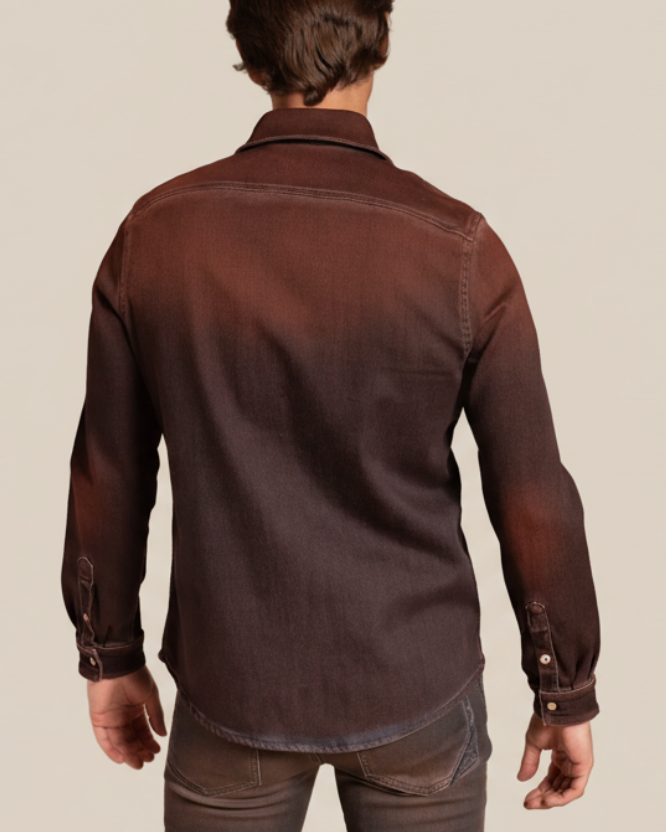 Man wearing a brown denim shirt against a beige background