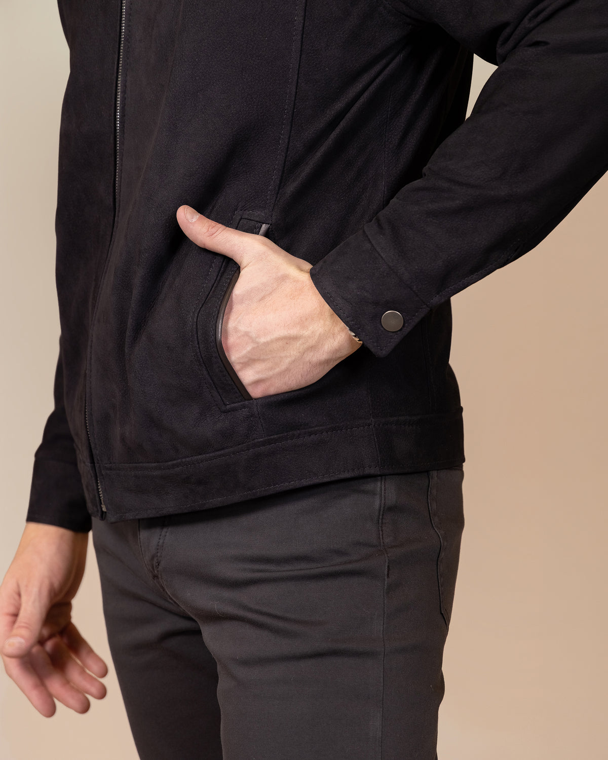 Close-up of the pocket construction and stitching and cuff links with a polished snap button on the Savio Ace Rustic nubuck calfskin jacket.