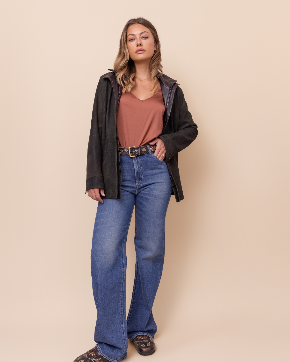 Woman wearing HYDE Cassia Moss Rustic distressed lambskin jacket — moss green with Rustic Napa trim, tailored fit, handcrafted in Los Angeles