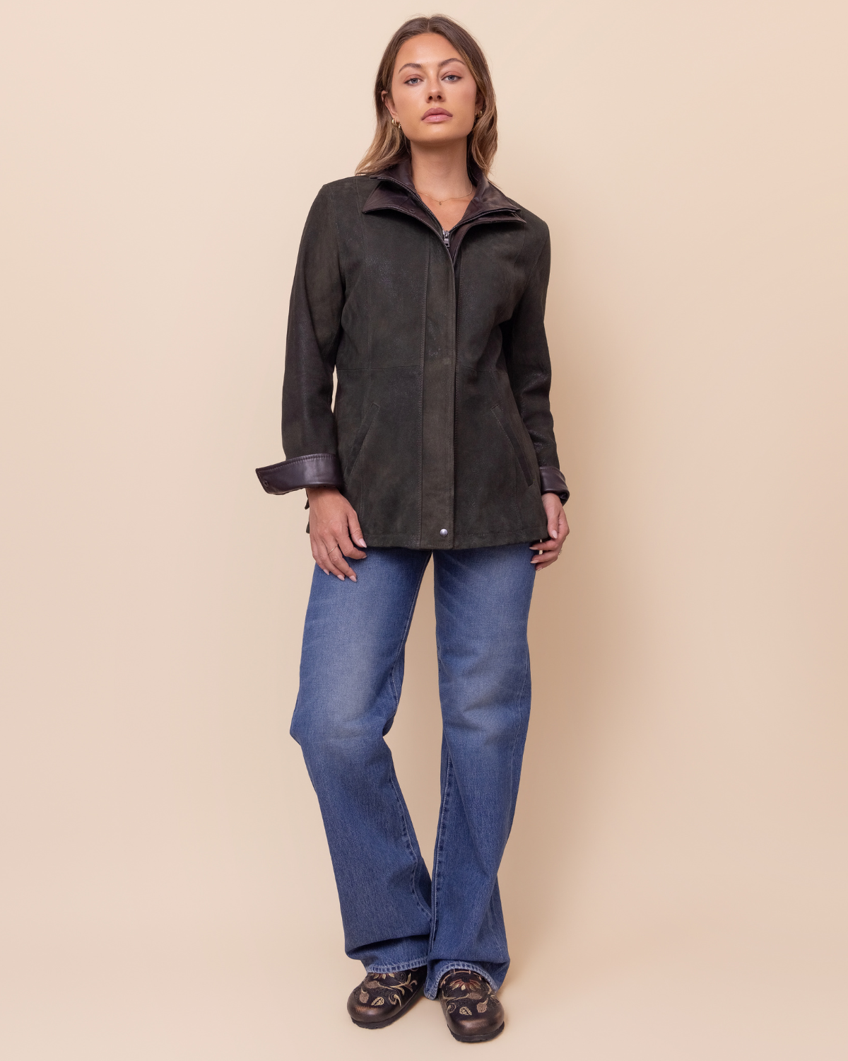 Woman wearing HYDE Cassia Moss Rustic lambskin jacket — tailored silhouette, distressed moss green leather, USA-made
