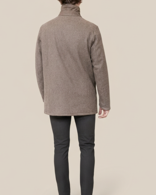 Man wearing a brown coat on a white background