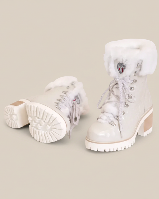White winter boots with fur lining on a white background