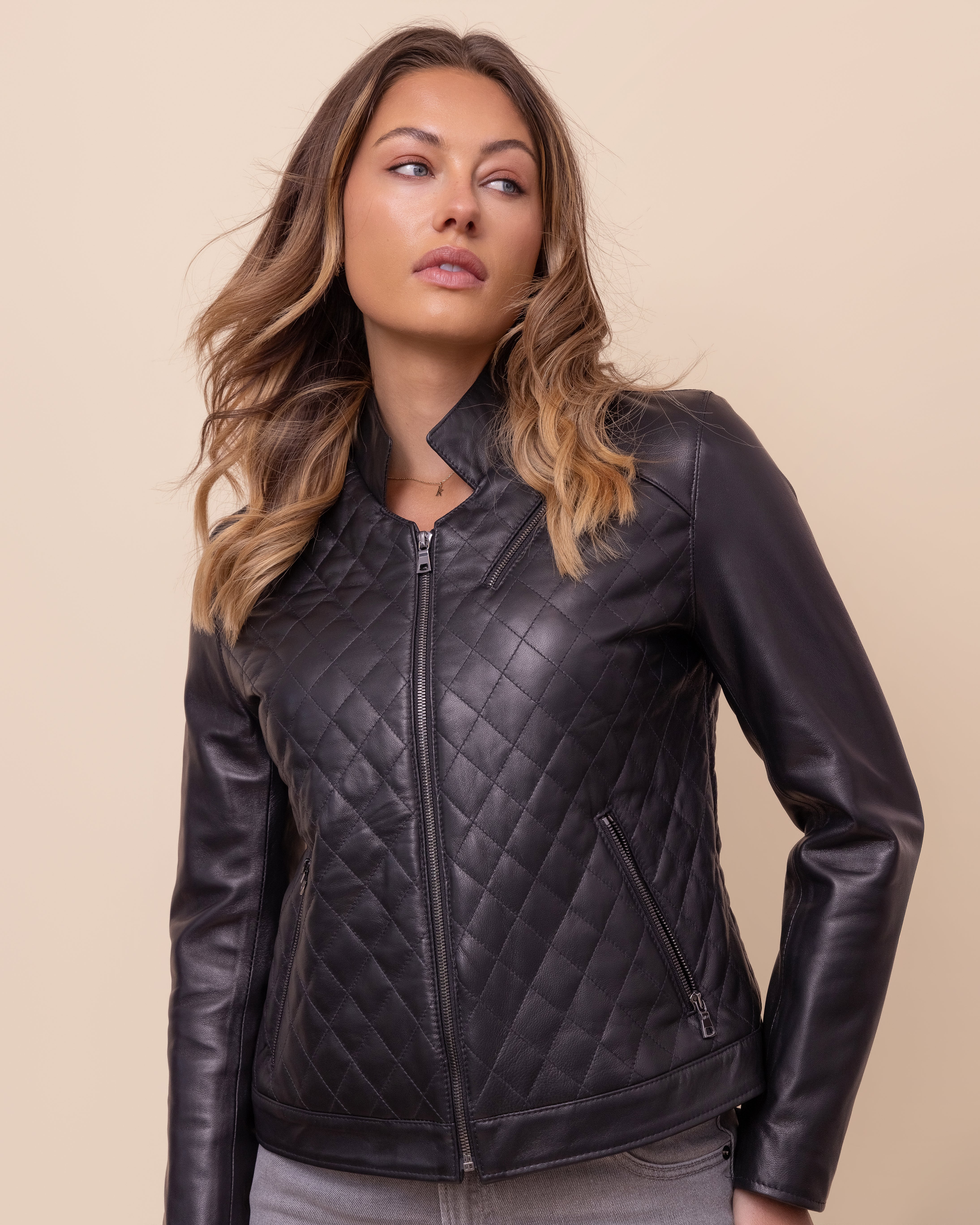 HYDE Carbon Noir quilted lambskin jacket — side profile showing smooth Napa sleeves and tailored fit, handcrafted in Los Angeles