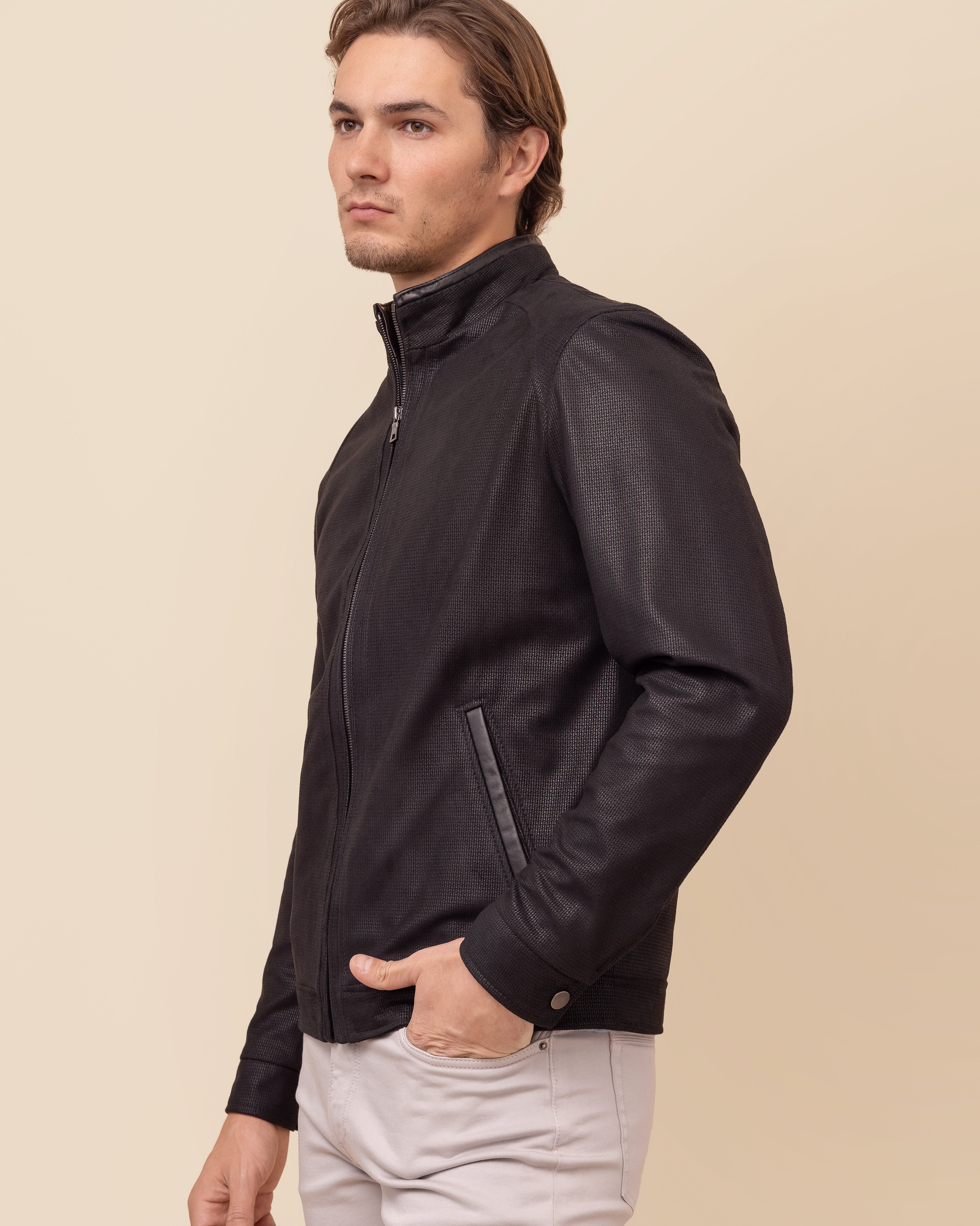 HYDE Obsidian Noir — close-up of drum-dyed embossed NuBuck Print lambskin texture and stand collar detail, deep black finish