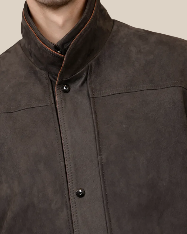 Close-up of a dark brown jacket with a neutral background