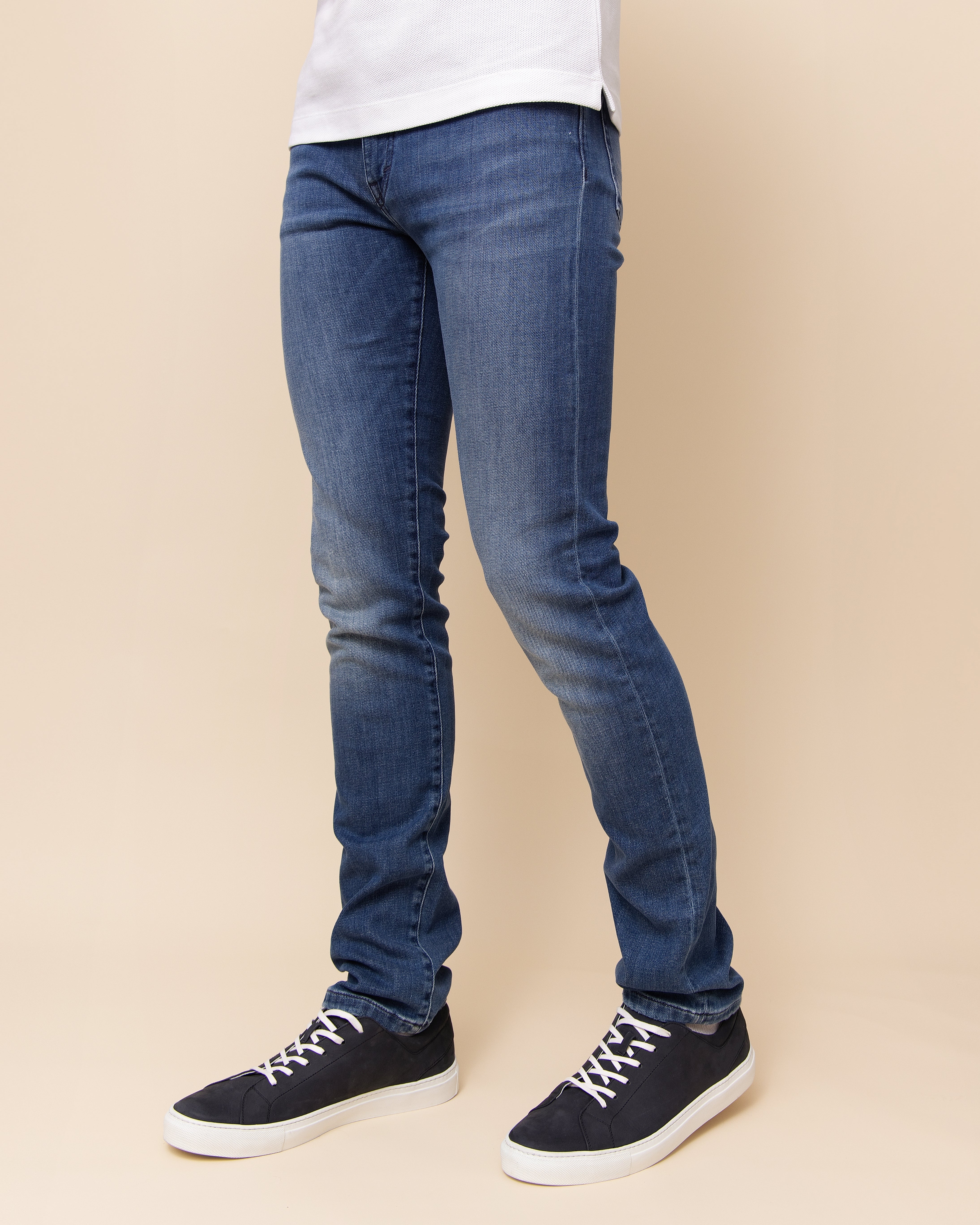 Medium blue Italian stretch denim jeans showing five-pocket construction and contrast stitching at back yokes, HYDE Cobra