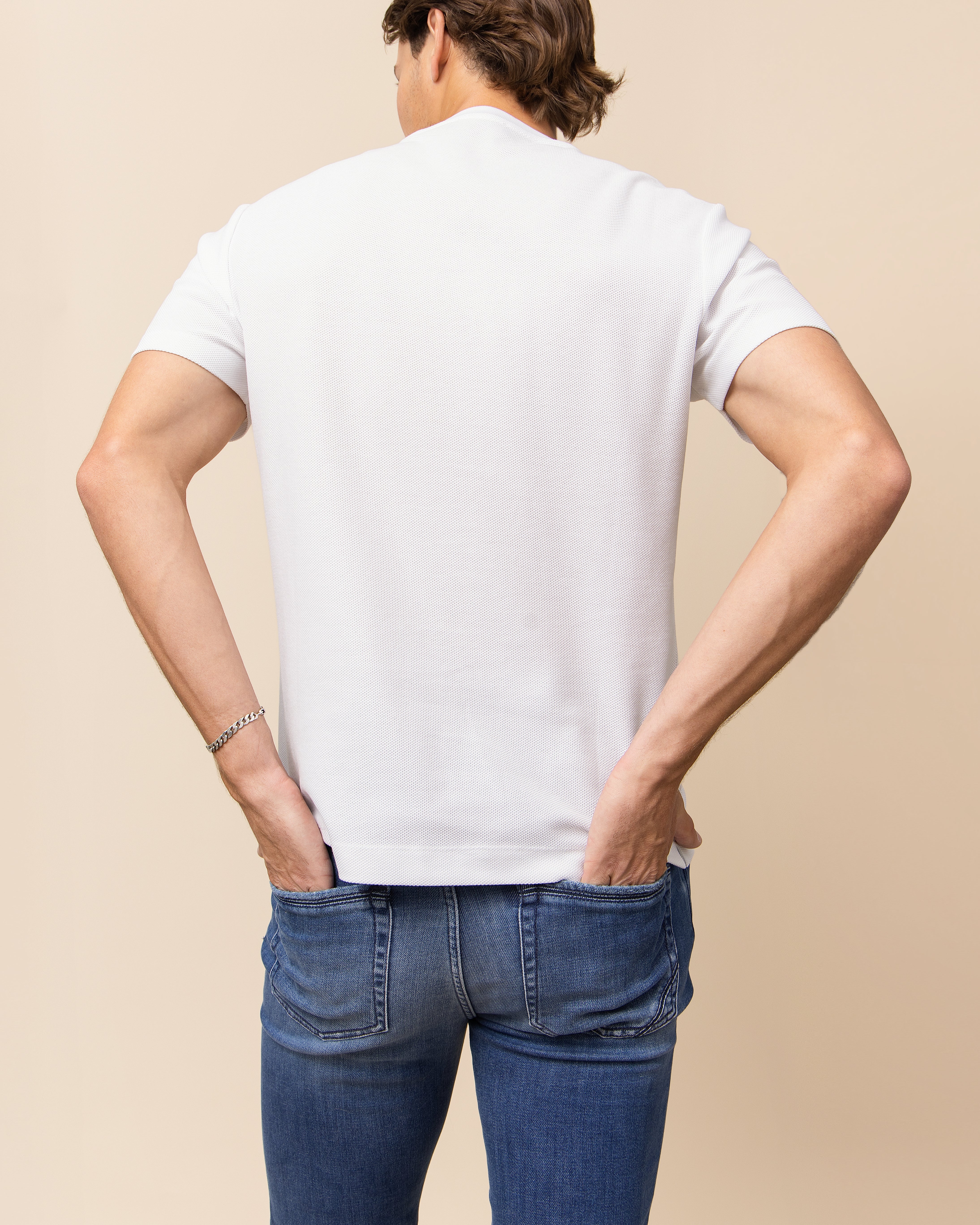 HYDE Cobra men's jeans in medium blue, close view of mid-wash fading and whiskering through the lap