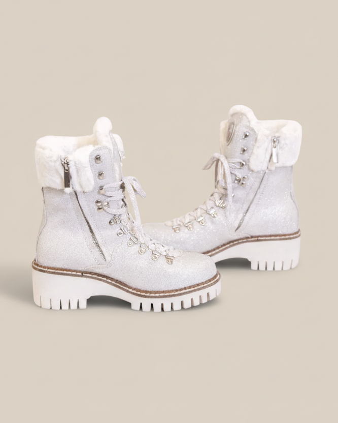 White winter boots with decorative elements on a white background