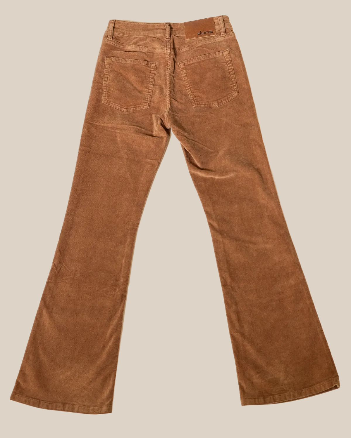 Brown moleskin
 pants on a light gray background