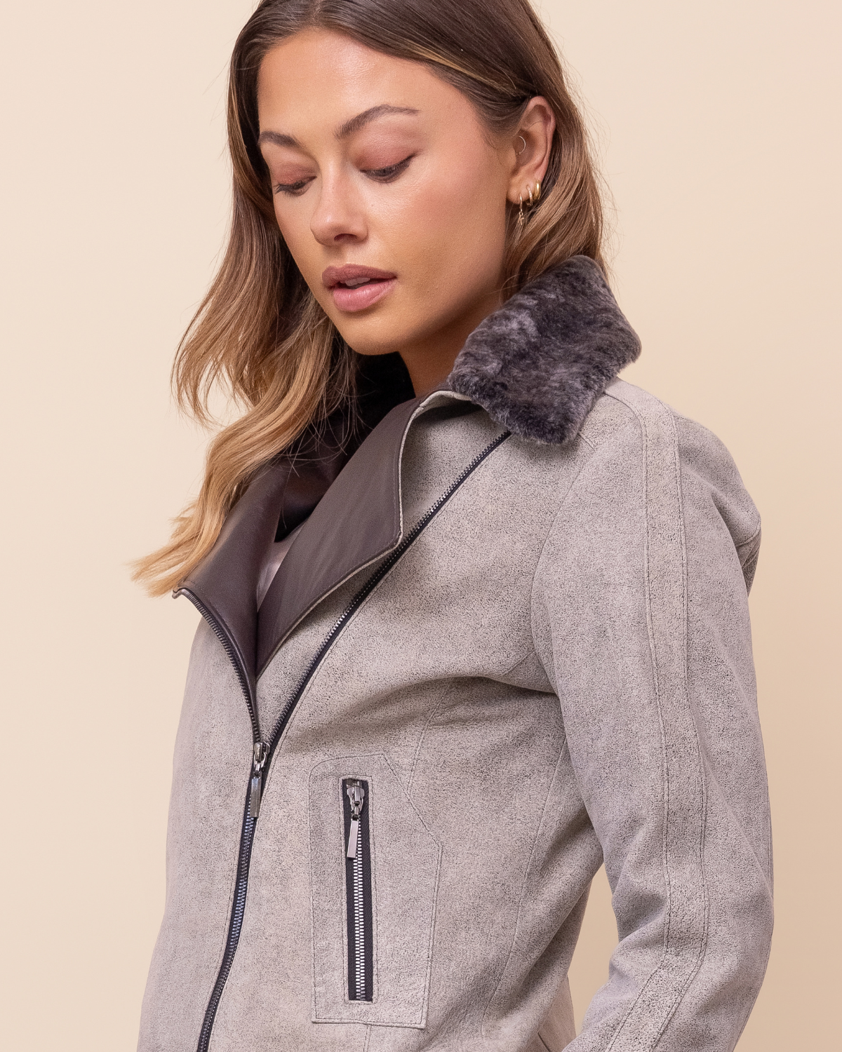 Woman wearing HYDE Elara Diego Rustic lambskin jacket — statement leather jacket with shearling collar, sizes XXS–L