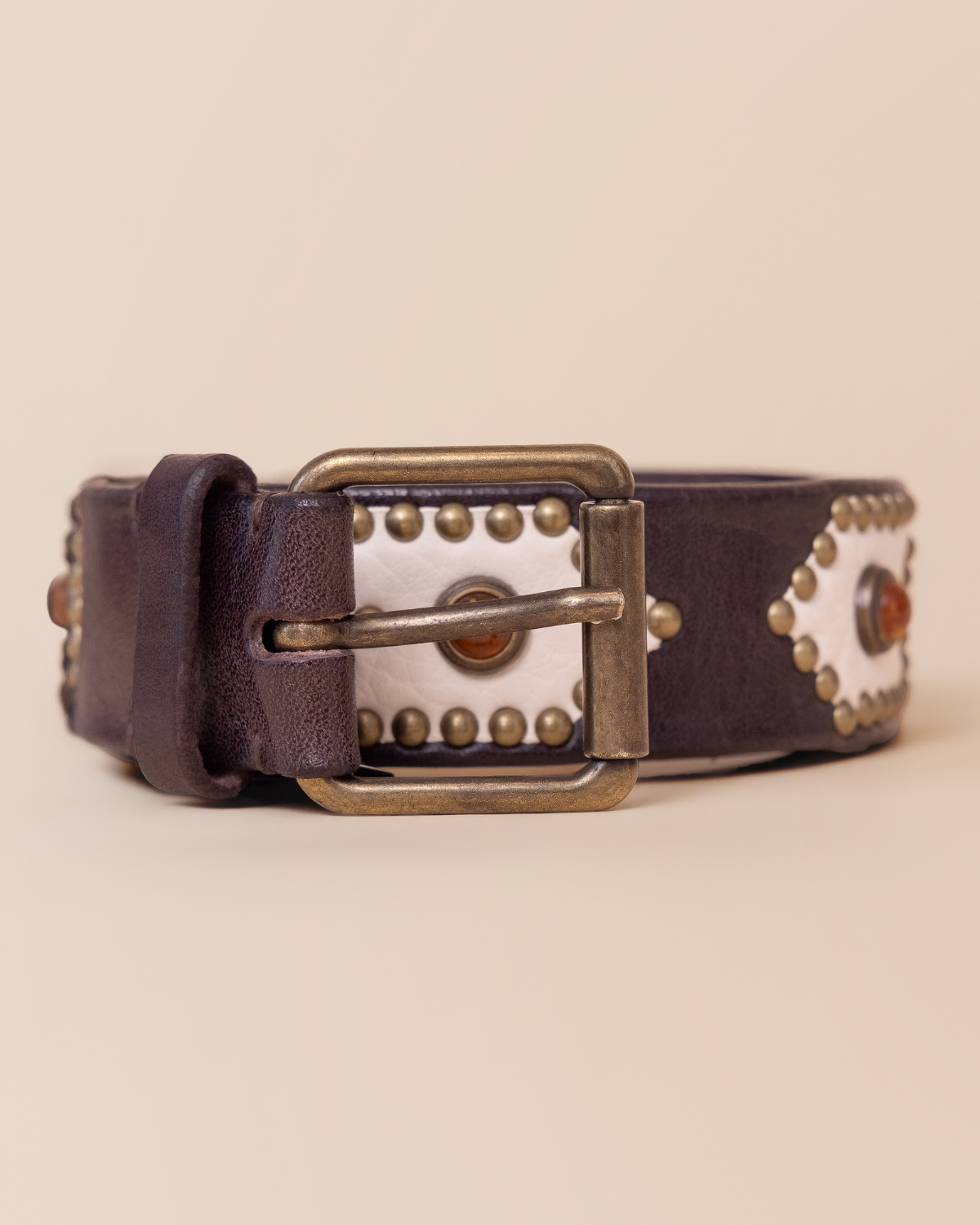 ull strap view with contrast panel inlays and stud detailing