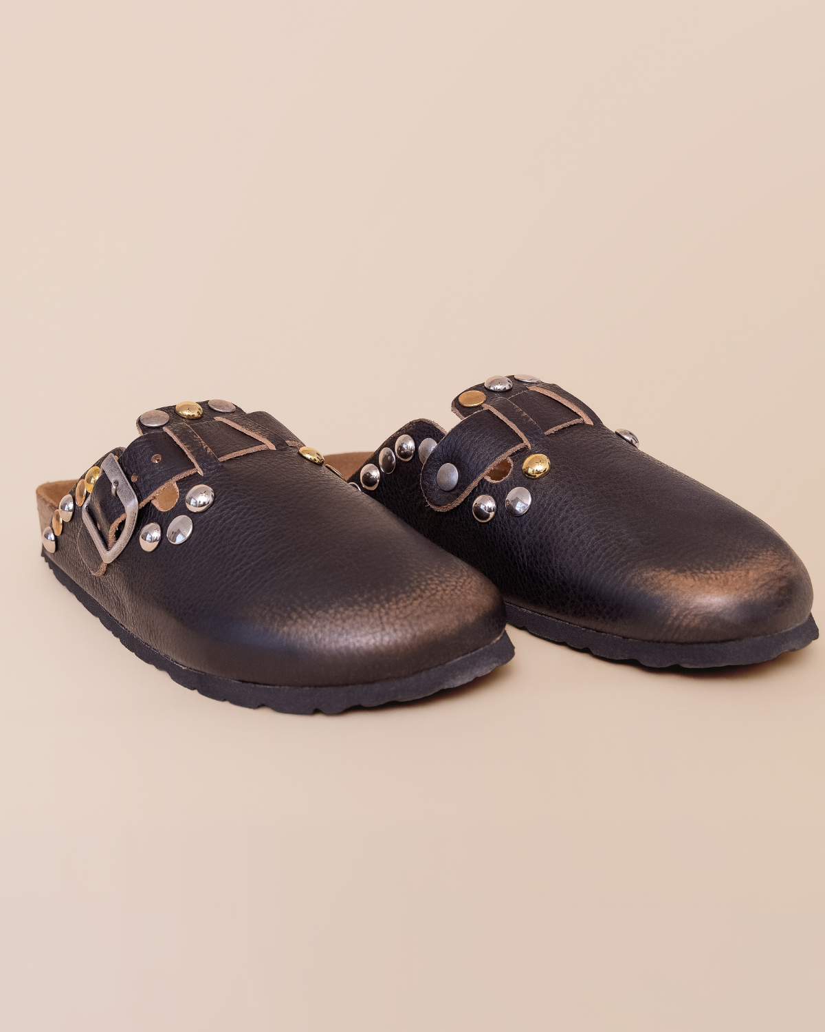 front view — closed almond toe and burnished nero finish