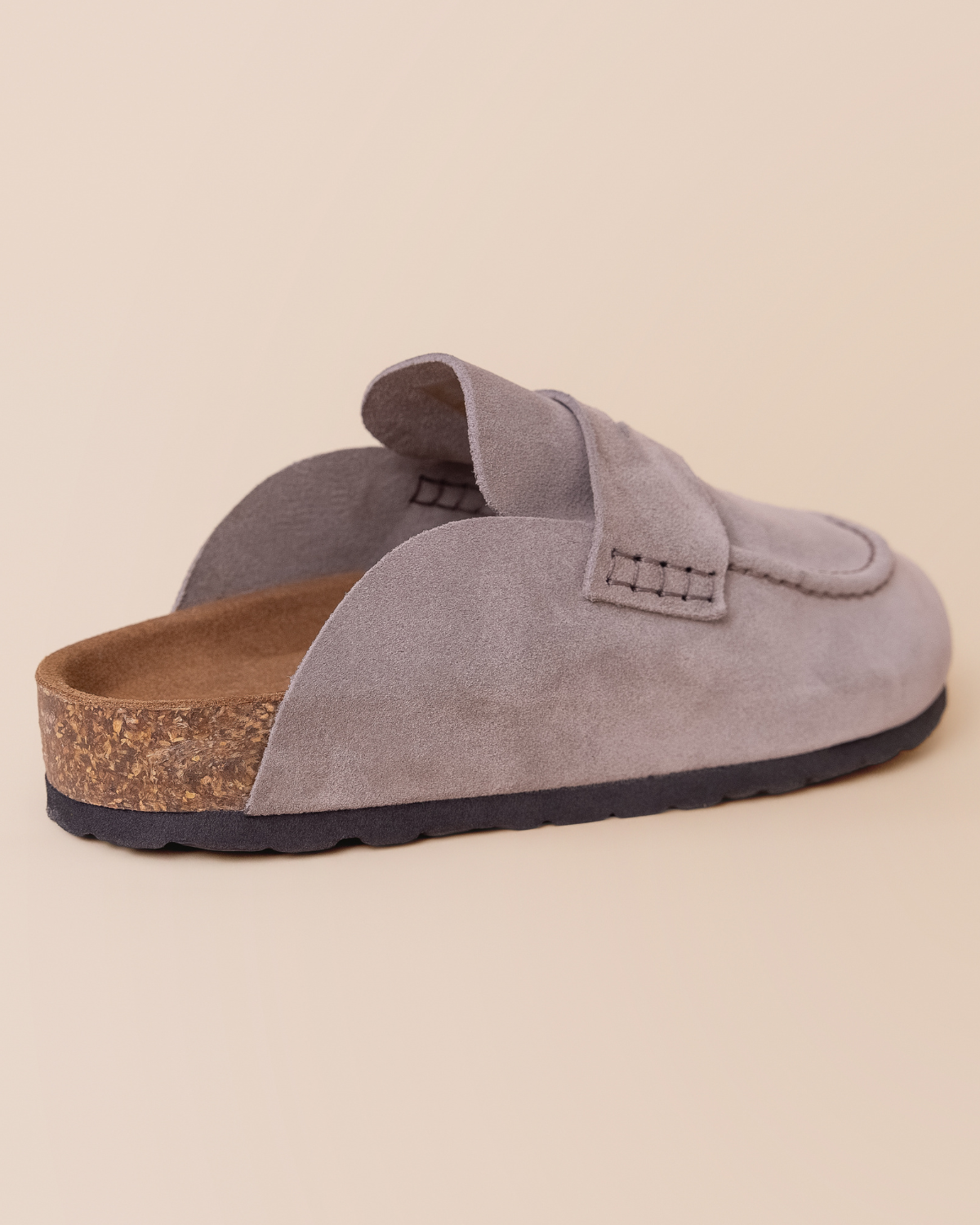 styled look — rubber sole and backless loafer silhouette