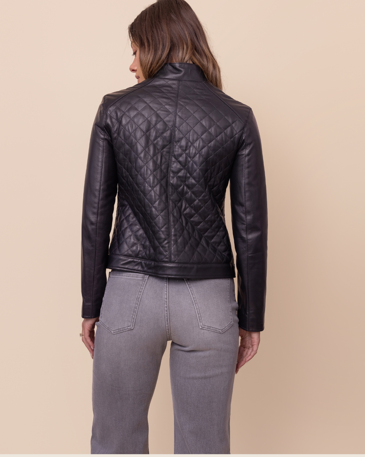 HYDE Carbon Noir quilted lambskin jacket styled — deep black quilted leather with Napa sleeves, tailored modern fit, USA-made