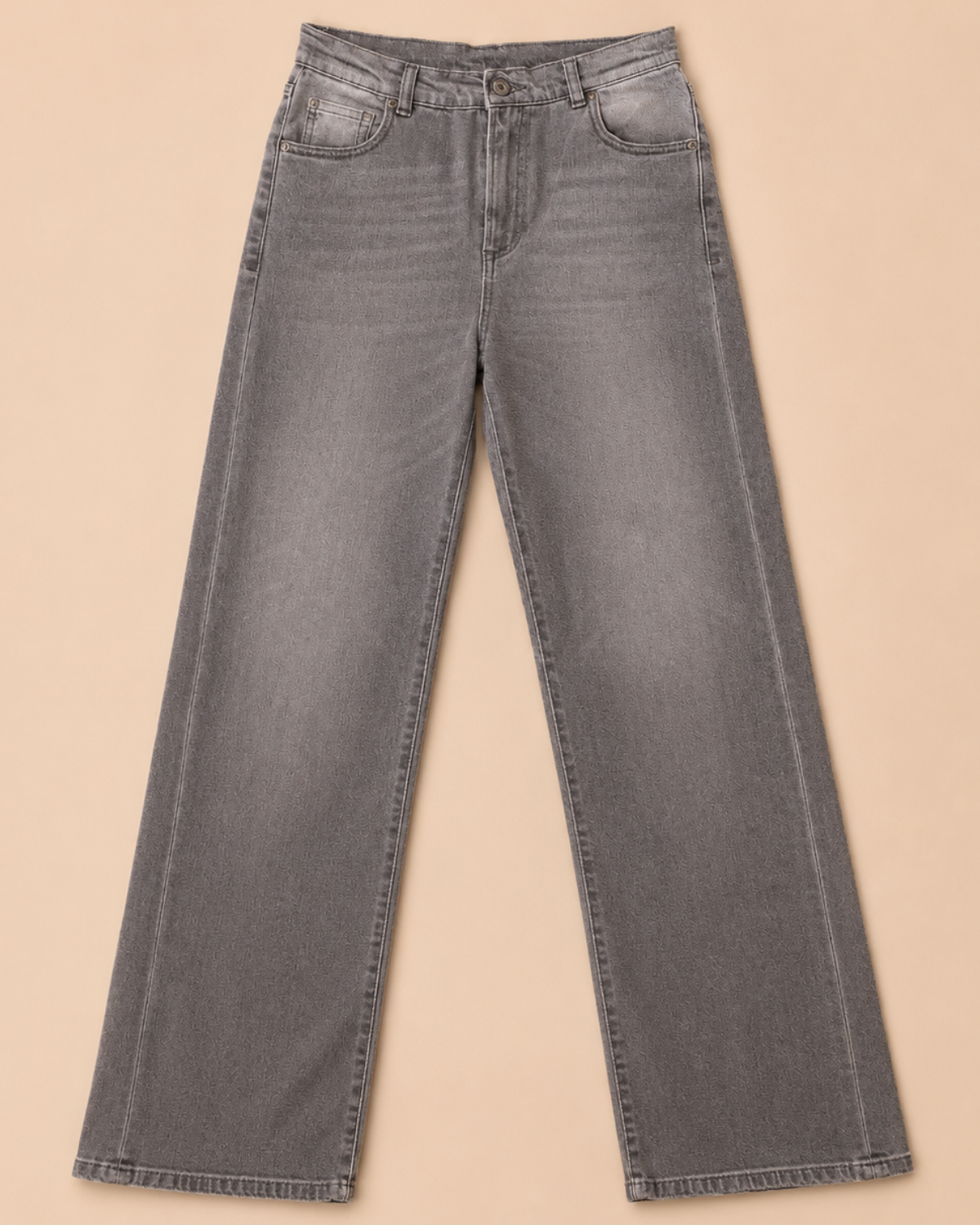 Gray jeans on a beige background