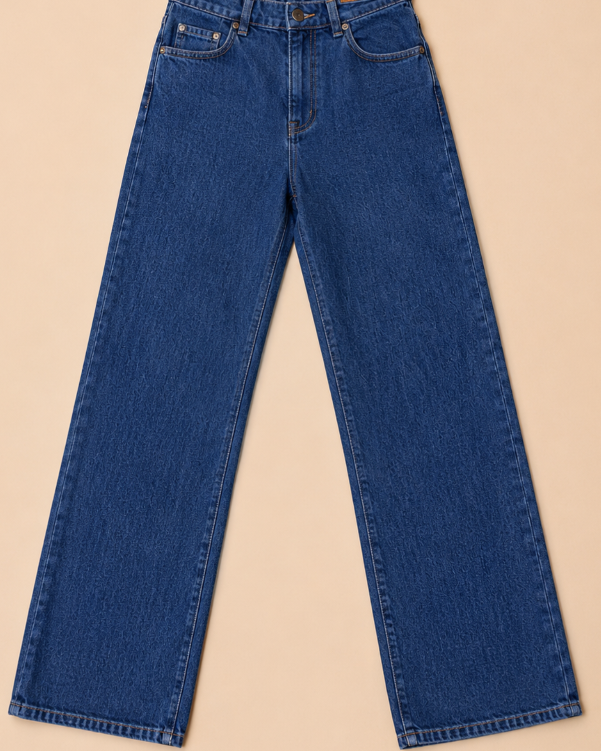 Blue jeans on a beige background