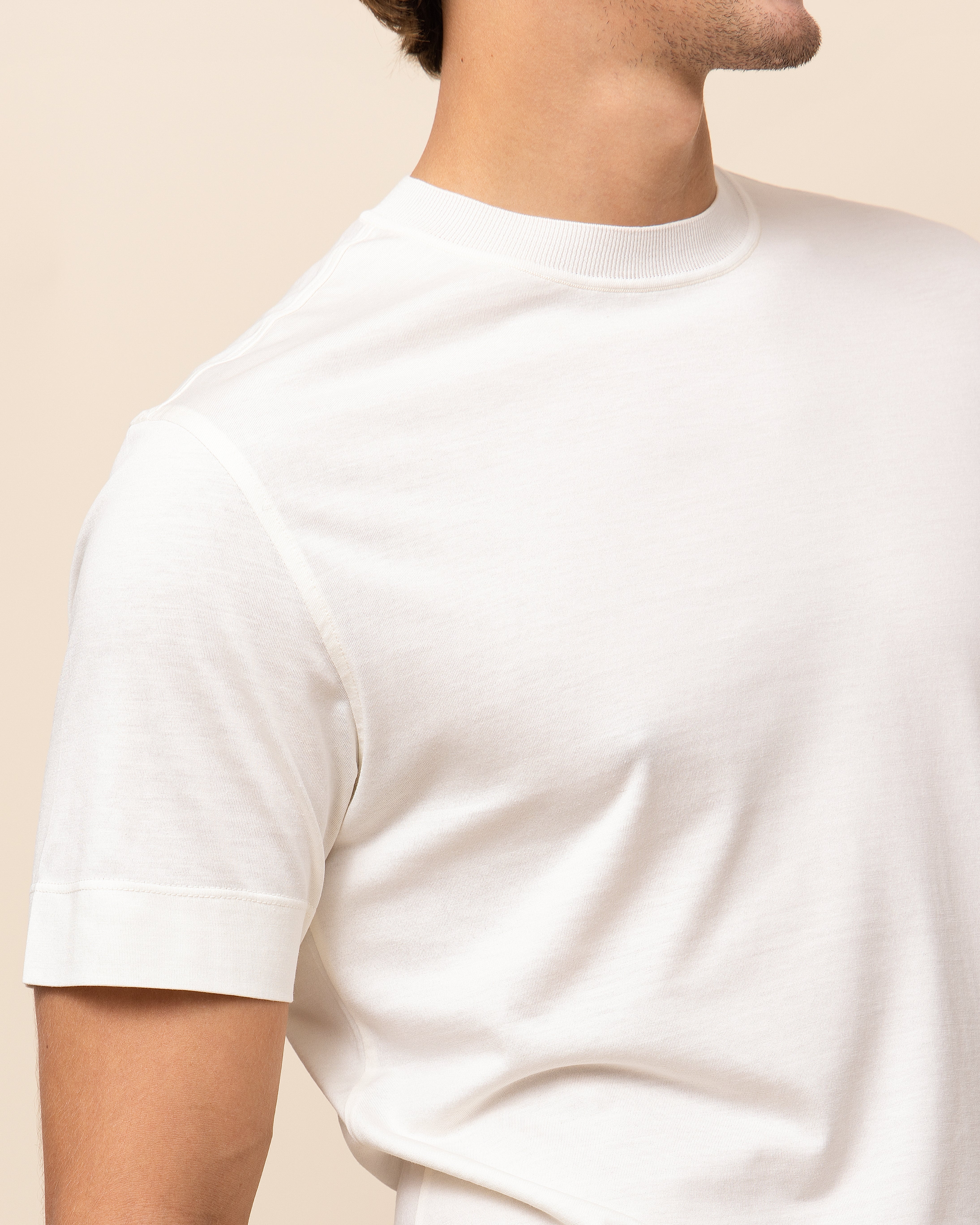 Off-white Italian silk-cotton crew neck tee showing ribbed neckline and fine jersey knit texture, HYDE Milano by Emiliano Zapata