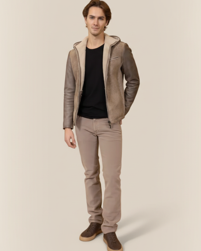 Man wearing a gray shearling leather jacket hood on a light background