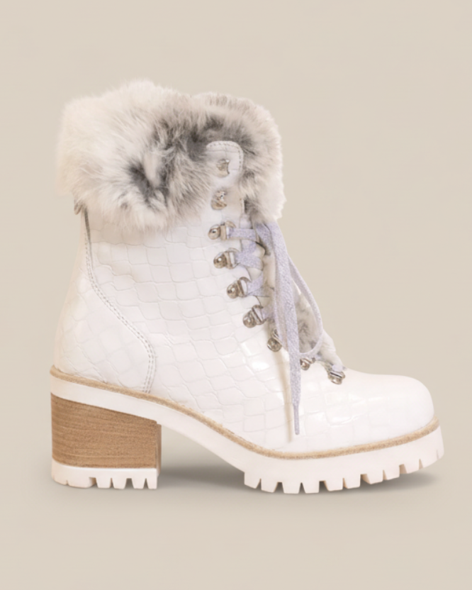 White winter boot with fur trim on a white background