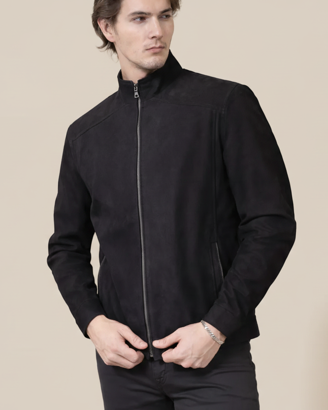 Man wearing a black jacket on a beige background